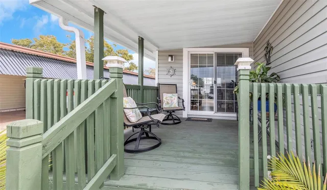 a view of swimming pool with seating space