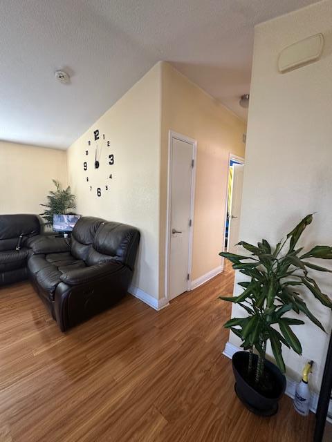 555 Umbarger Road, Unit 108 San Jose, CA 95111 - Photo 2 of 15 a living room with furniture potted plant and a wooden floor
