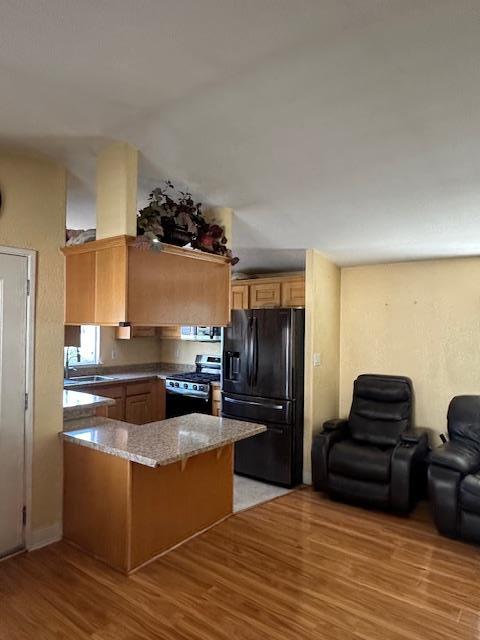 555 Umbarger Road, Unit 108 San Jose, CA 95111 - Photo 3 of 15 a kitchen with stainless steel appliances granite countertop a refrigerator and a stove top oven