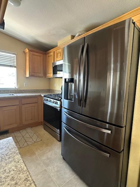 555 Umbarger Road, Unit 108 San Jose, CA 95111 - Photo 5 of 15 a kitchen with granite countertop stainless steel appliances and counter space