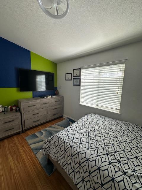 555 Umbarger Road, Unit 108 San Jose, CA 95111 - Photo 8 of 15 a bedroom with a bed and a television