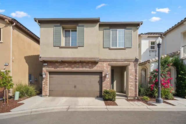 a front view of a house with yard