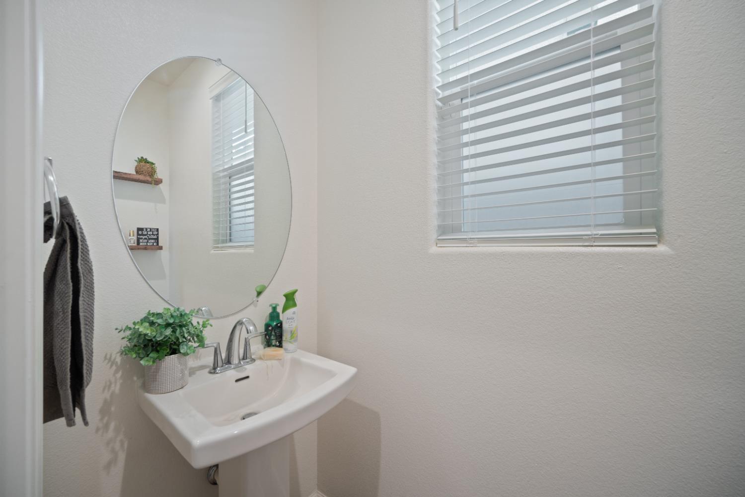 855 Wishon Avenue Madera, CA 93636 - Photo 12 of 29 a bathroom with a sink and a mirror