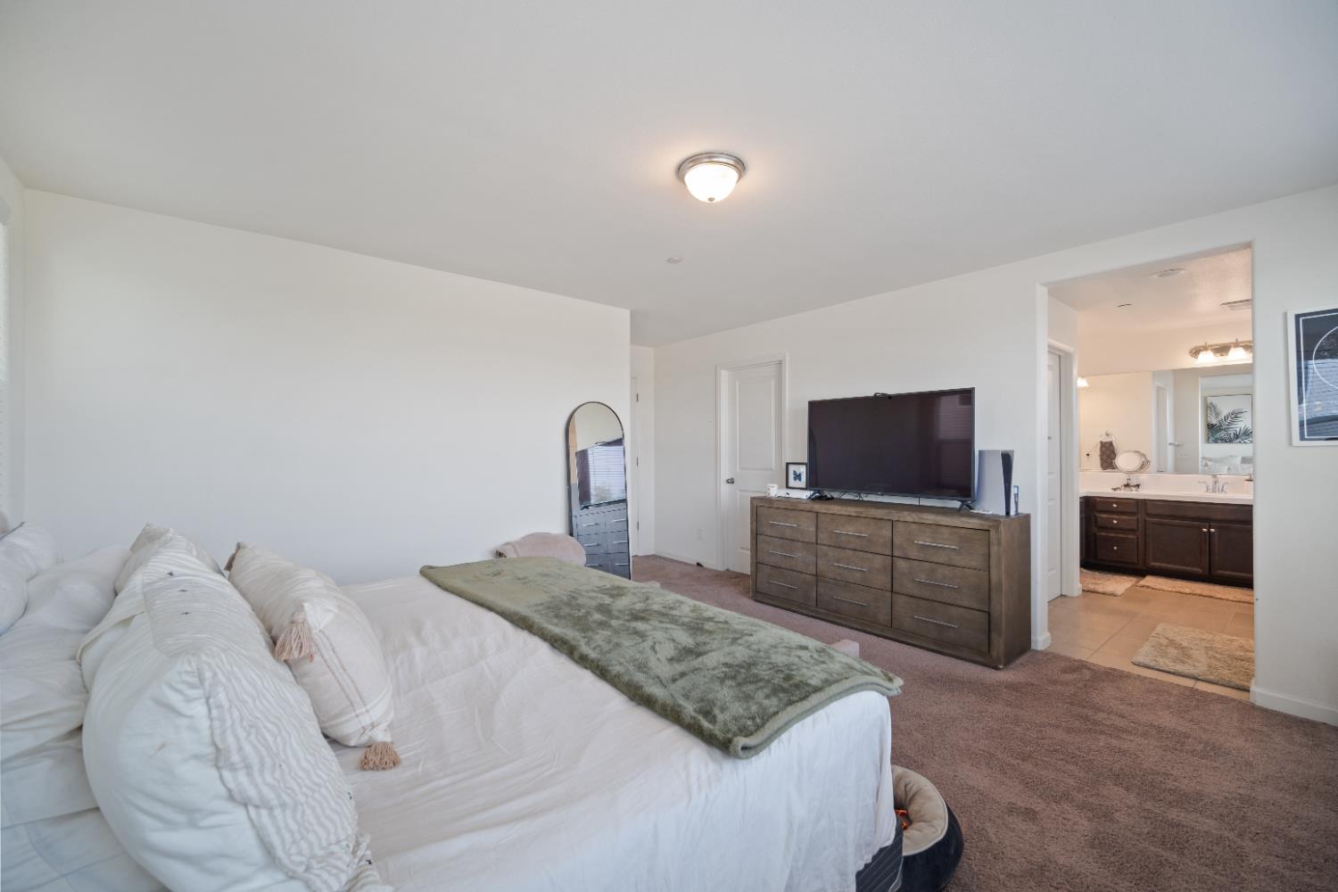 855 Wishon Avenue Madera, CA 93636 - Photo 14 of 29 a bedroom with a bed and a television in it