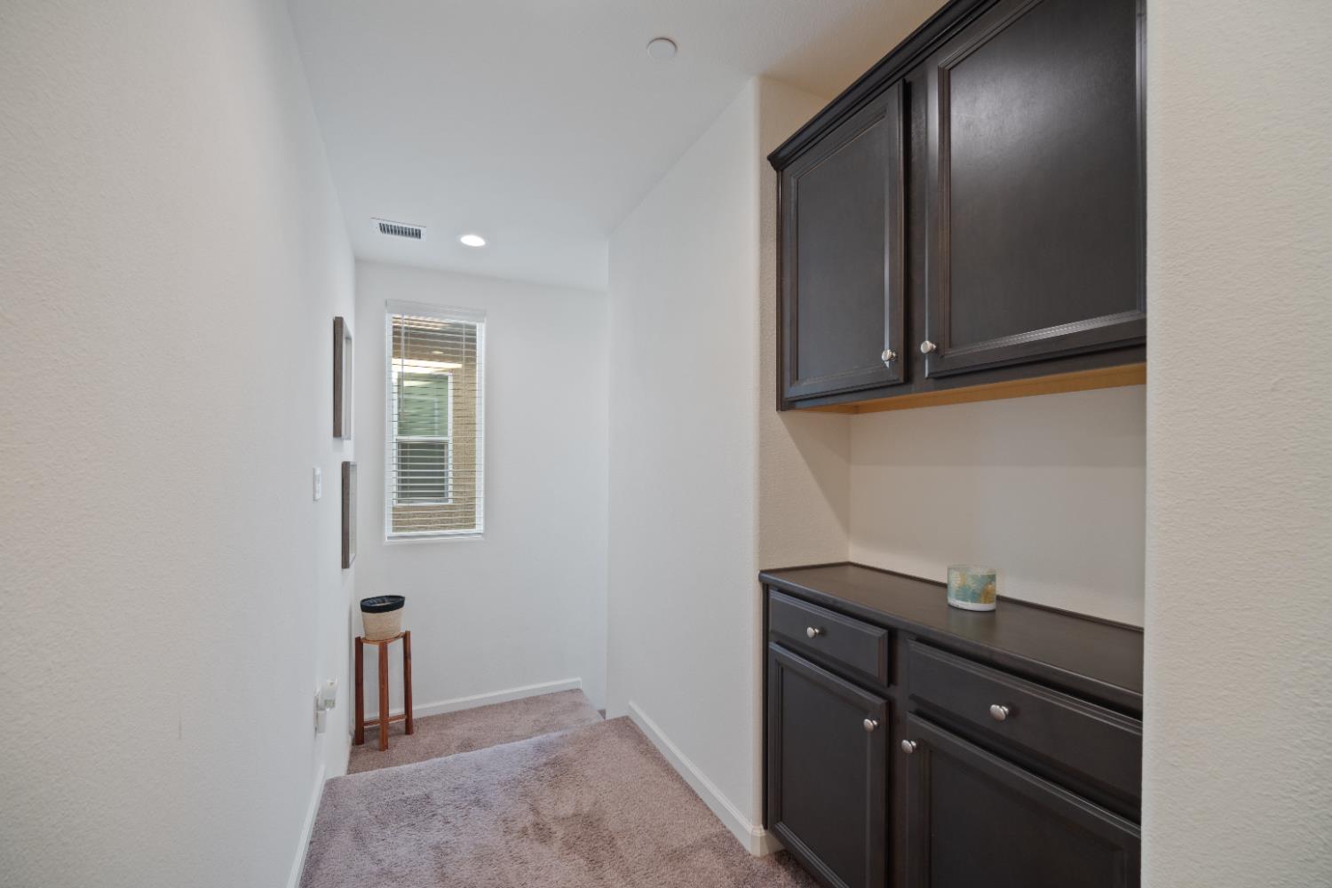 855 Wishon Avenue Madera, CA 93636 - Photo 17 of 29 a room with a mirror and a wooden floor