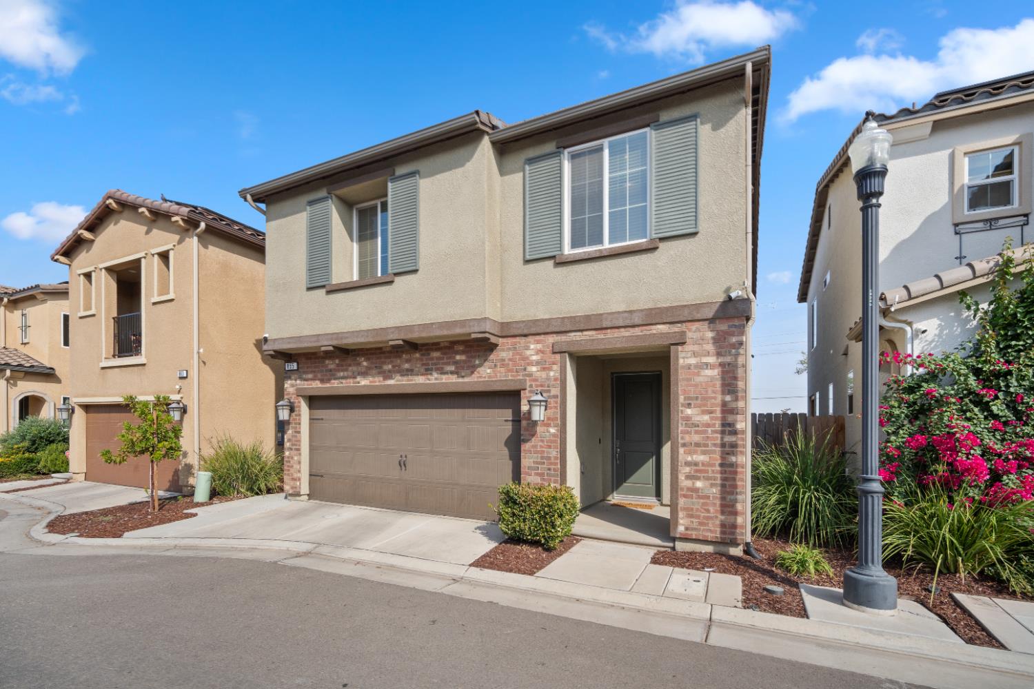 855 Wishon Avenue Madera, CA 93636 - Photo 2 of 29 a front view of a house with a yard and garage