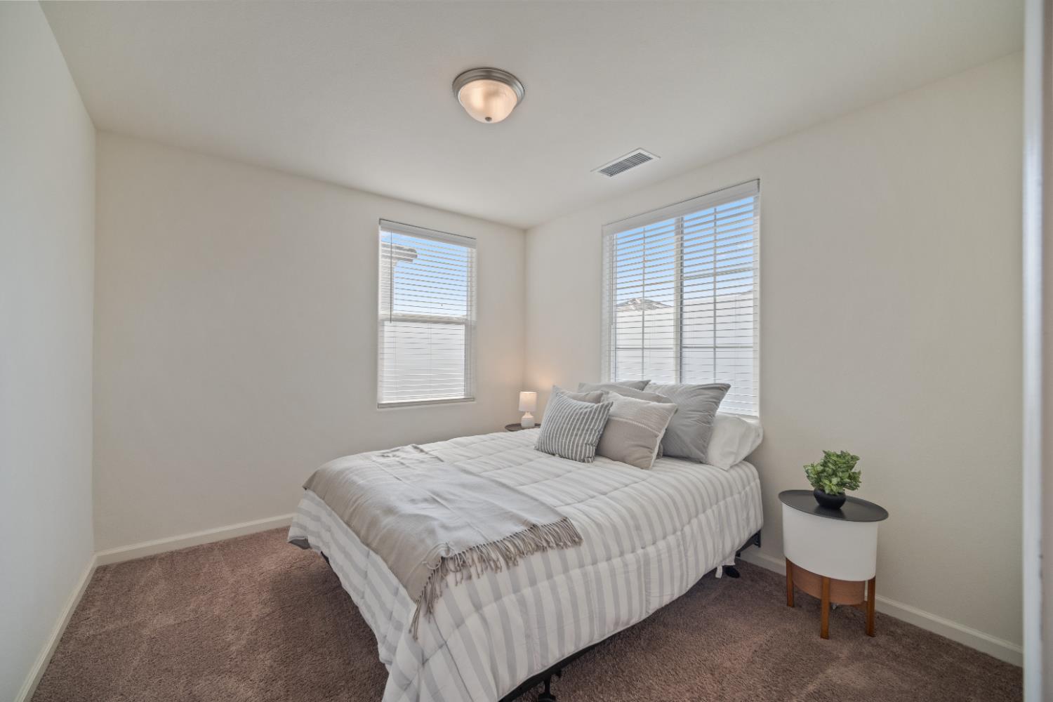 855 Wishon Avenue Madera, CA 93636 - Photo 21 of 29 a bedroom with a bed and a window