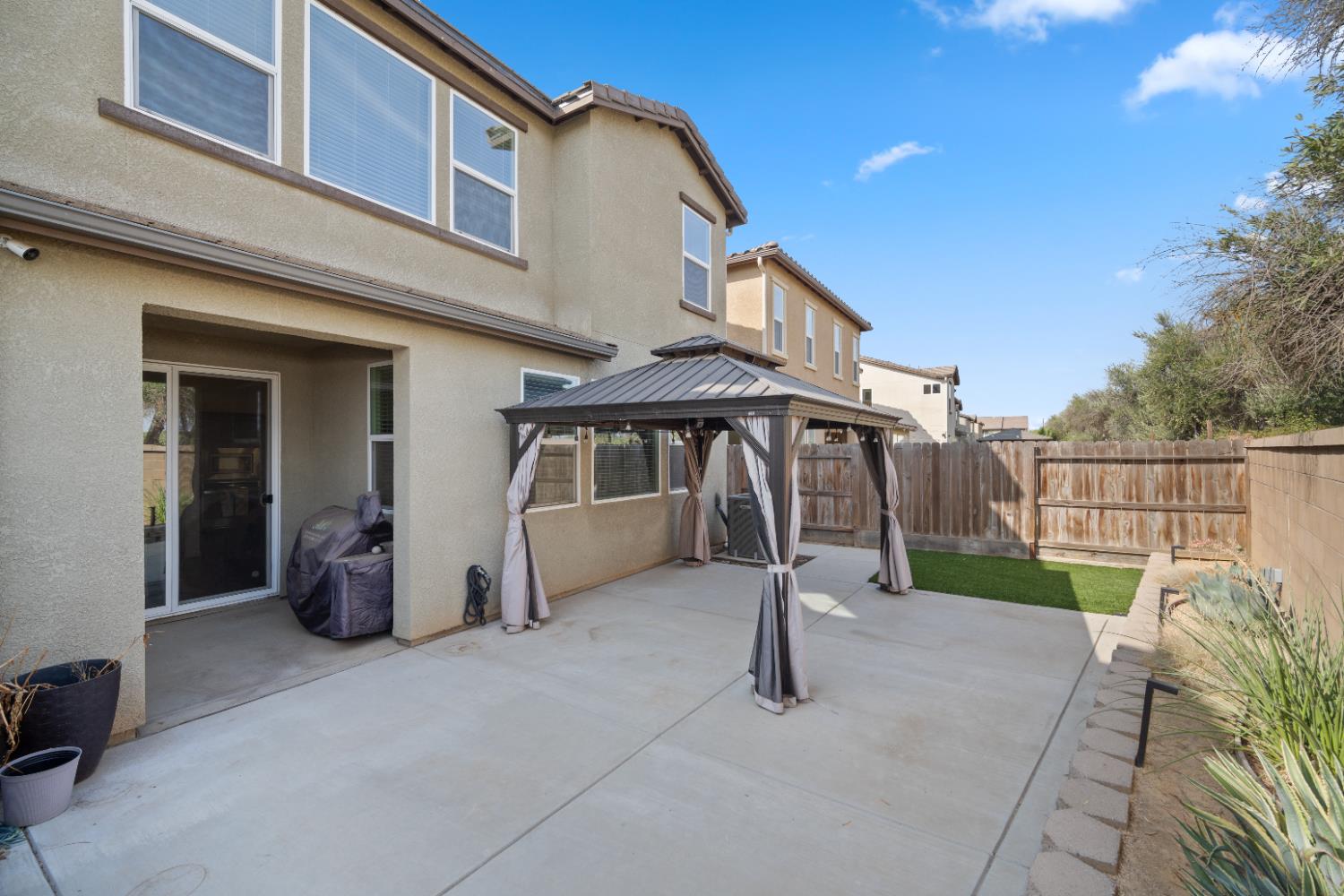 855 Wishon Avenue Madera, CA 93636 - Photo 22 of 29 a view of a house with backyard and sitting area