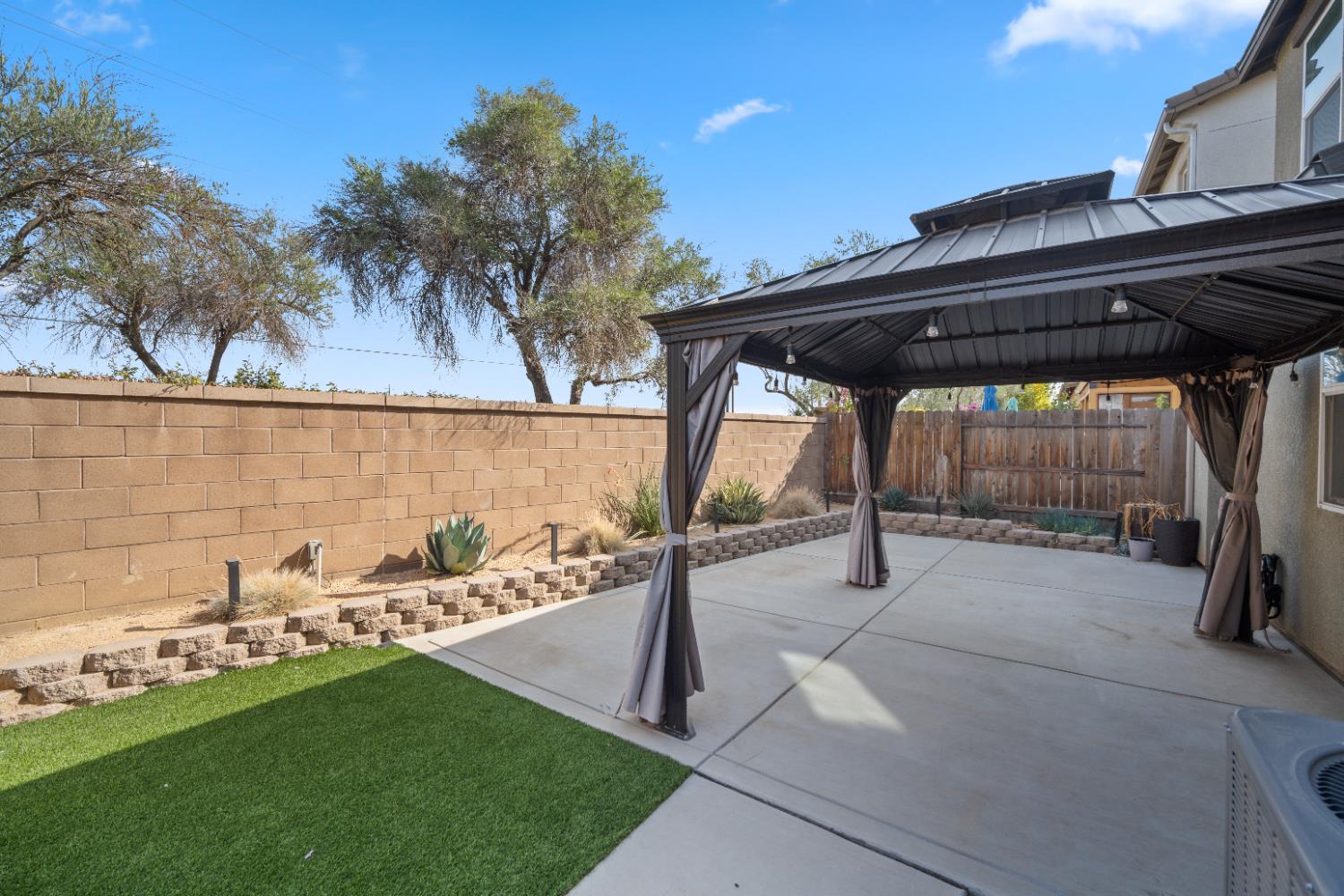 855 Wishon Avenue Madera, CA 93636 - Photo 25 of 29 a backyard of a house with table and chairs