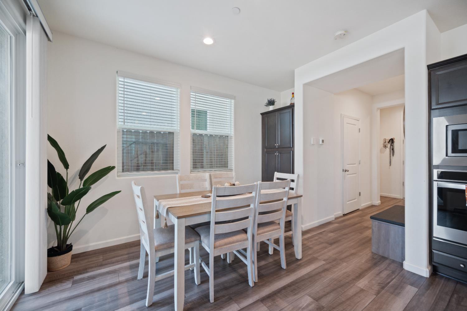 855 Wishon Avenue Madera, CA 93636 - Photo 10 of 29 a view of a dining room with furniture window and wooden floor