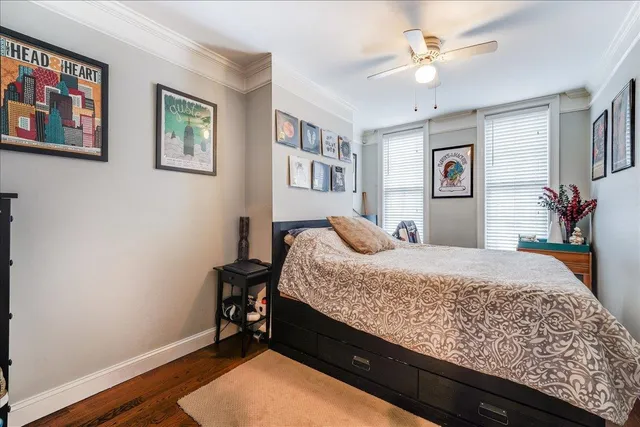 a bed room with a bed and a chandelier