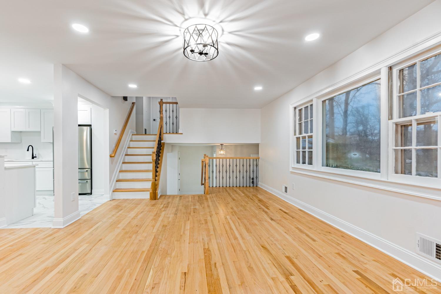 20 Warwick Road Edison, NJ 08820 - Photo 17 of 34 a view of empty room with wooden floor and fan