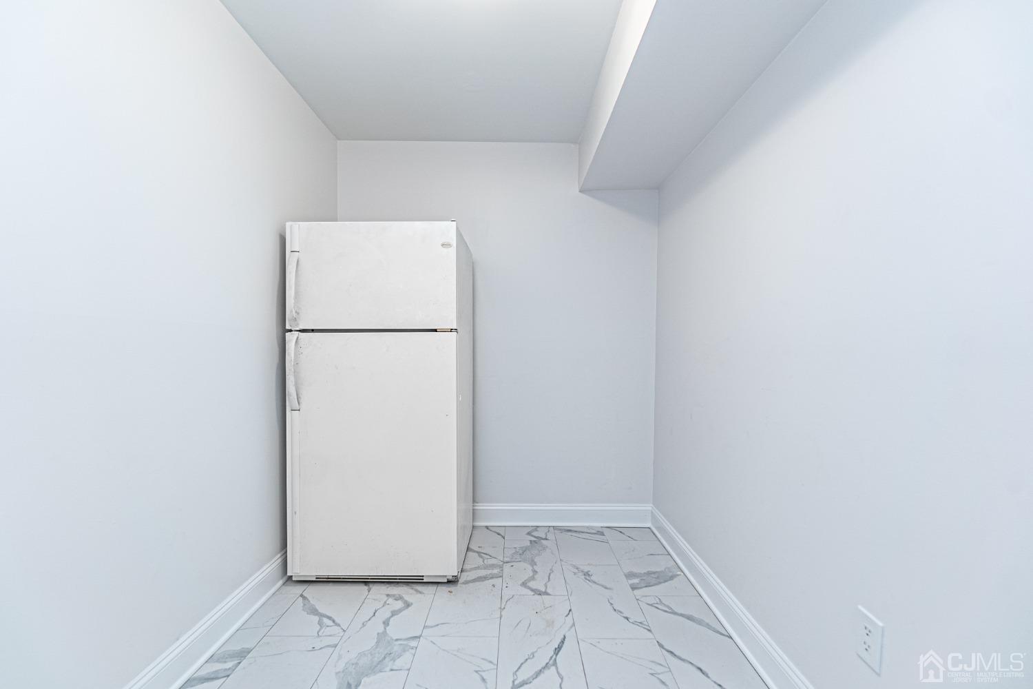 20 Warwick Road Edison, NJ 08820 - Photo 32 of 34 a view of a refrigerator in a kitchen