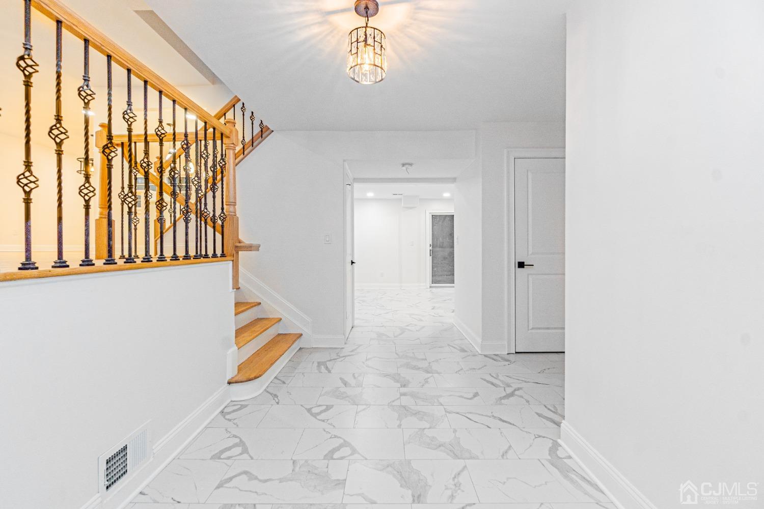 20 Warwick Road Edison, NJ 08820 - Photo 6 of 34 a view of an entryway with wooden floor