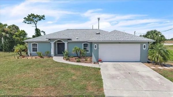 a front view of a house with garden and porch