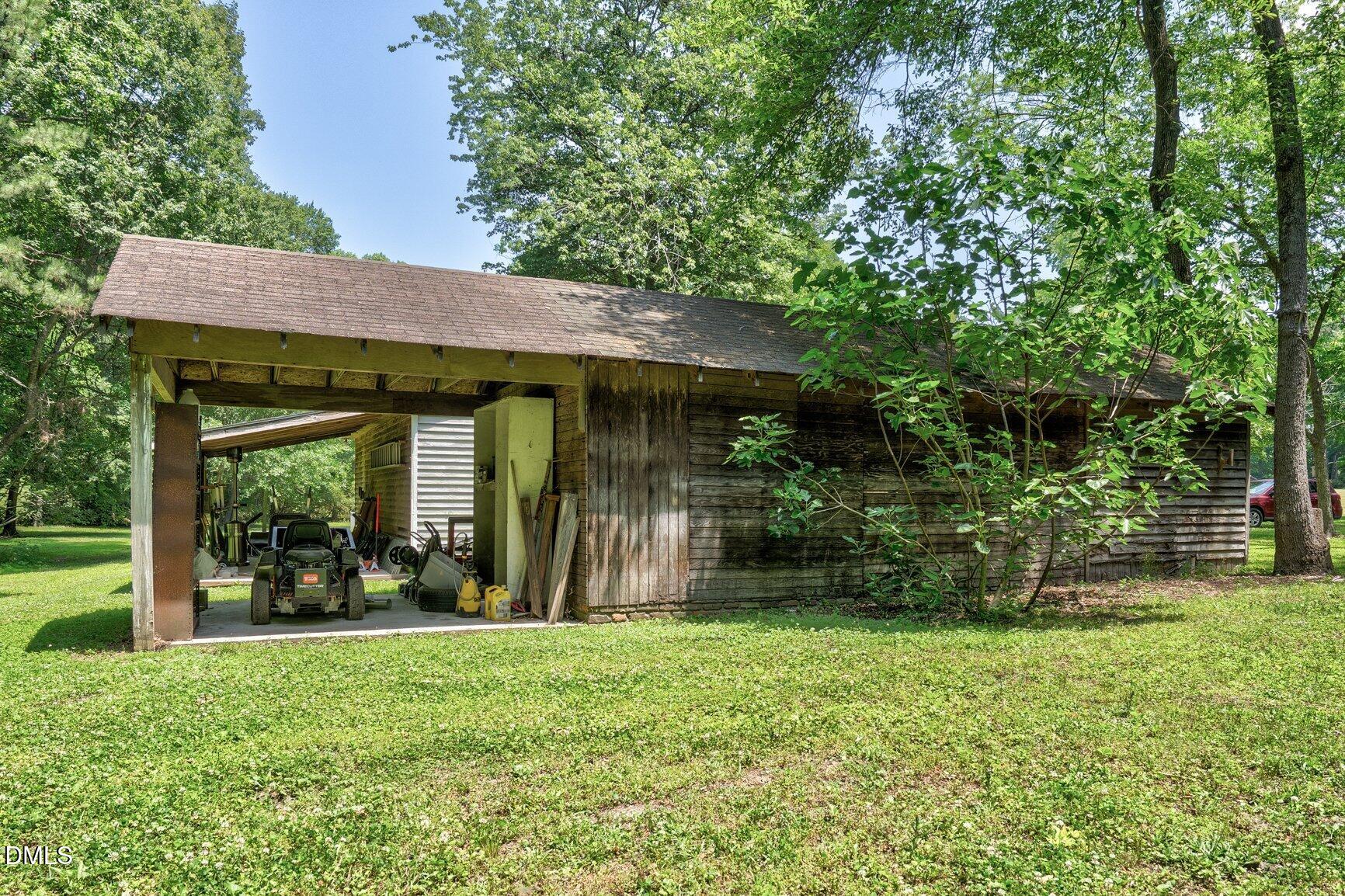726 Thomas Road Rocky Mount, NC 27801 - Photo 48 of 55 a view of a house that has garden