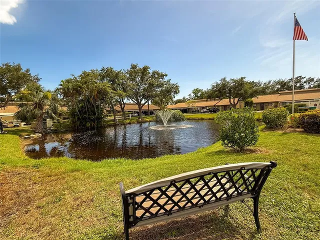 a view of a lake with a yard