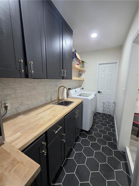150 Sims Street Winder, GA 30680 - Photo 22 of 61 a kitchen with a sink toilet and cabinets