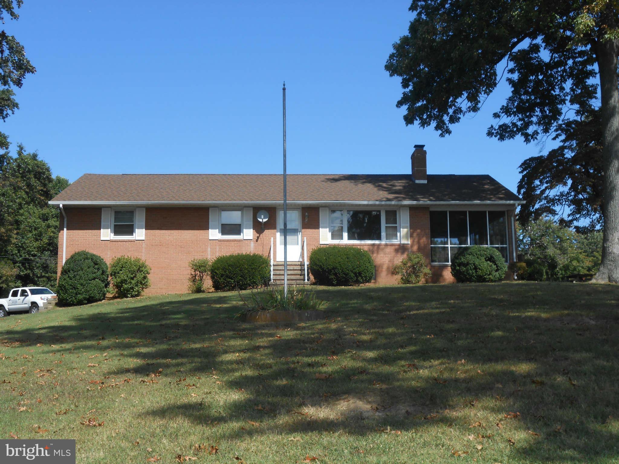 24244 Half Pone Point Road Hollywood, MD 20636 - Photo 1 of 19 a front view of a house with a yard