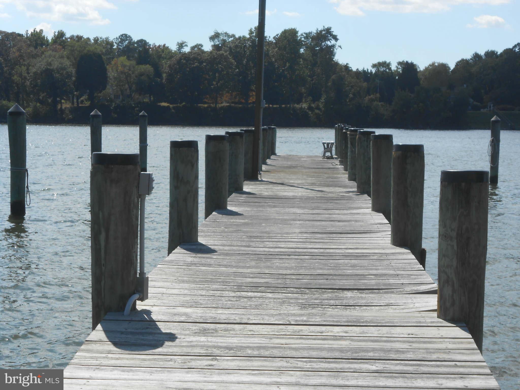 24244 Half Pone Point Road Hollywood, MD 20636 - Photo 17 of 19 a view of stairs and yard with wooden floor