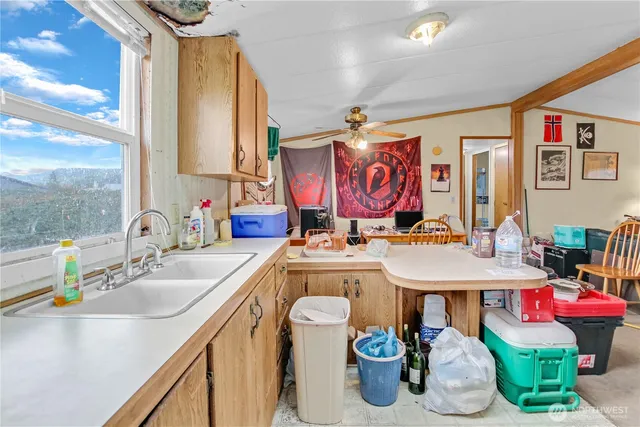 a bathroom with a sink a vanity and a large mirror