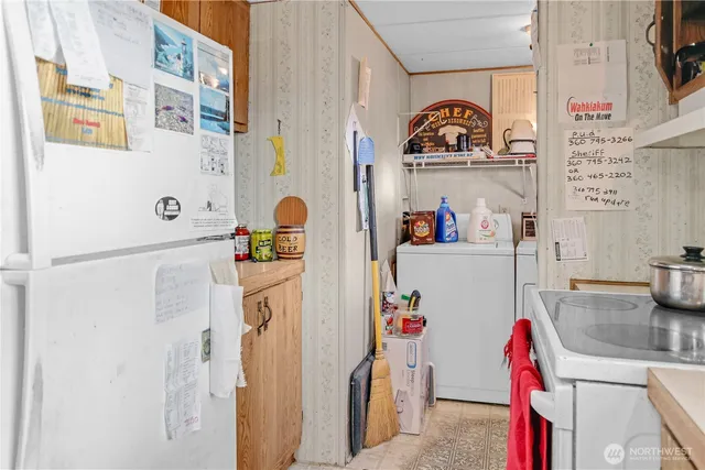 a utility room with a sink dryer and washer