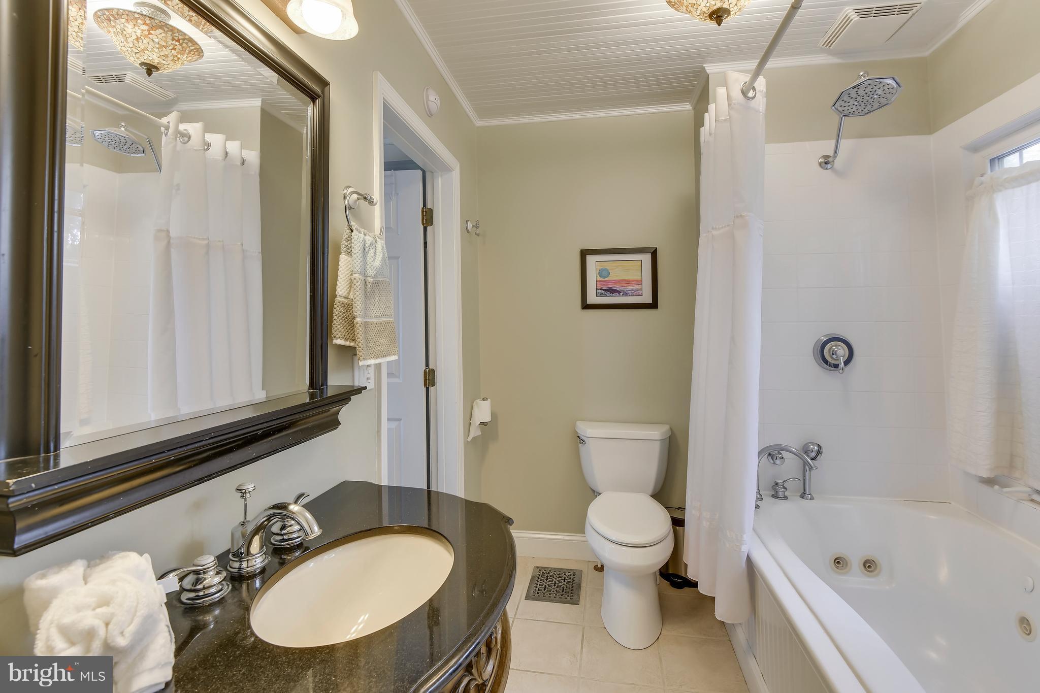 396 Riverside Drive Pasadena, MD 21122 - Photo 16 of 30 Main level full bath features laundry room