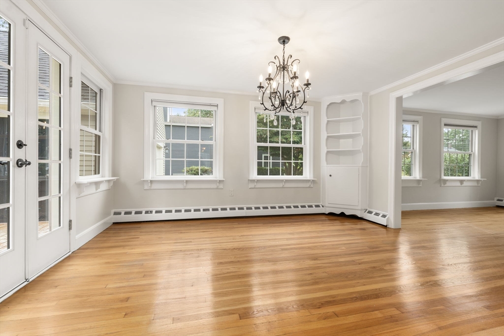 92 Abbot Street Andover, MA 01810 - Photo 15 of 35 an empty room with wooden floor and windows