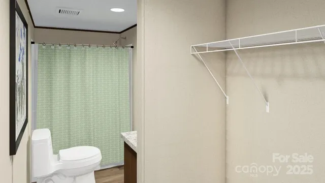 a bathroom with a toilet and shower