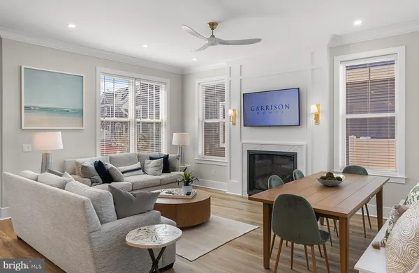 a living room with furniture window and a fireplace