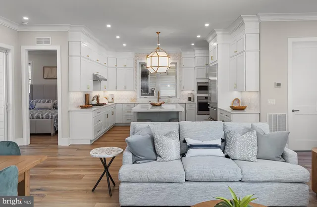 a view of entryway with wooden floor and stairs