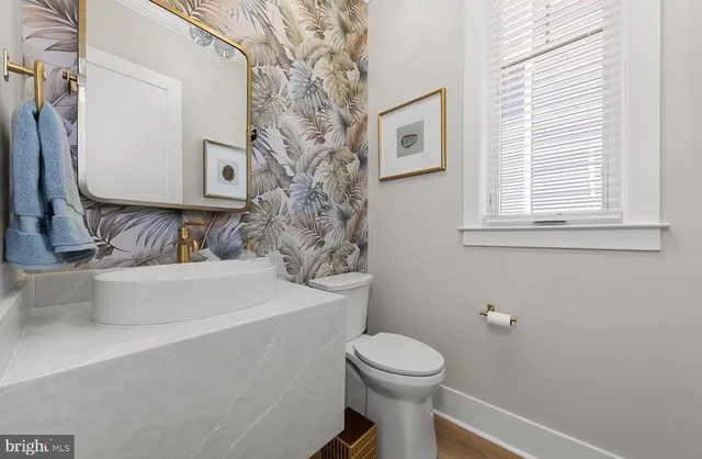 a view of a patio with couches and a dining table with chairs