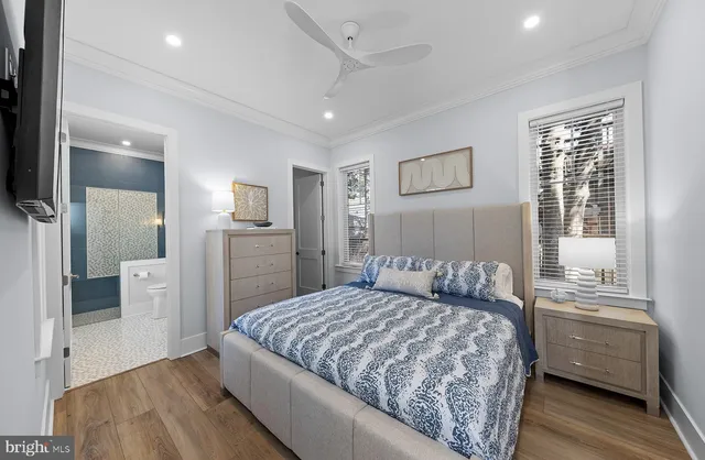 a view of entryway with wooden floor and stairs