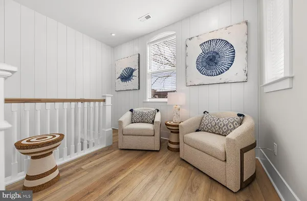 a bathroom with a tub shower and mirror