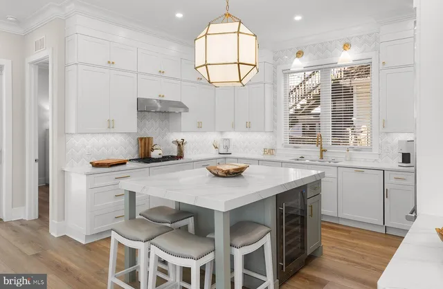a kitchen with a sink cabinets and window