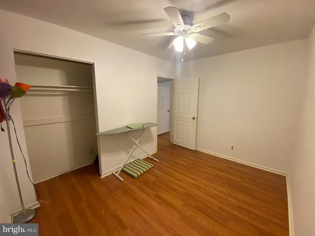 a bathroom with a sink a toilet and a large mirror