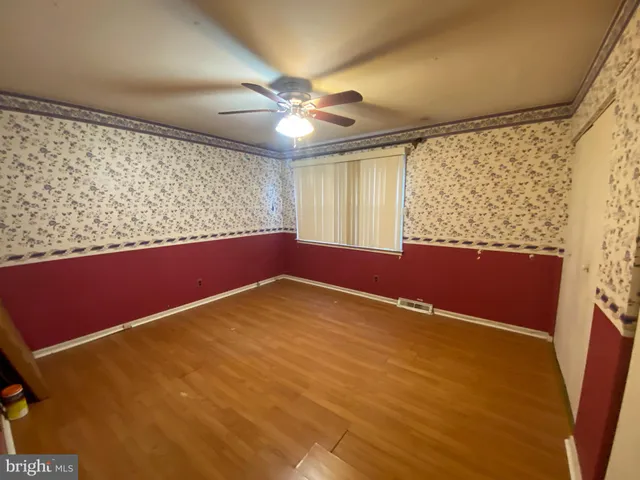 a bed room with a bed and a window