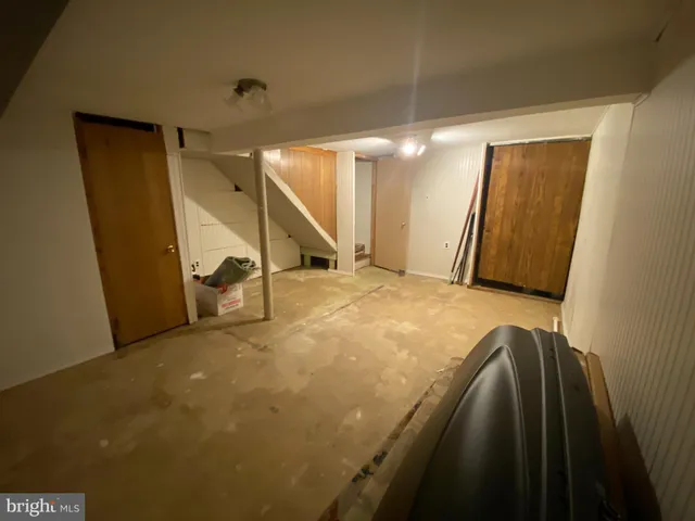 a bedroom with a bed and cabinets