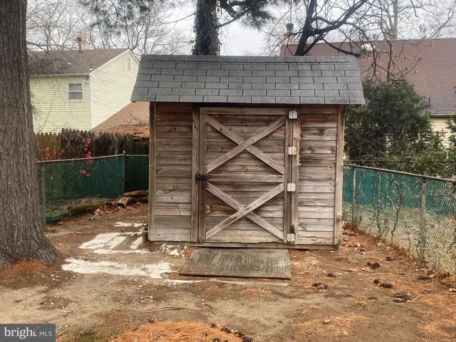 a view of a house with backyard porch and sitting area