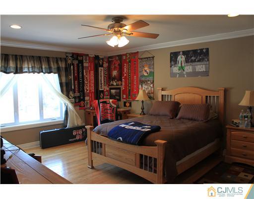 417 Plainfield Road Edison, NJ 08820 - Photo 12 of 14 a living room with furniture and a chandelier