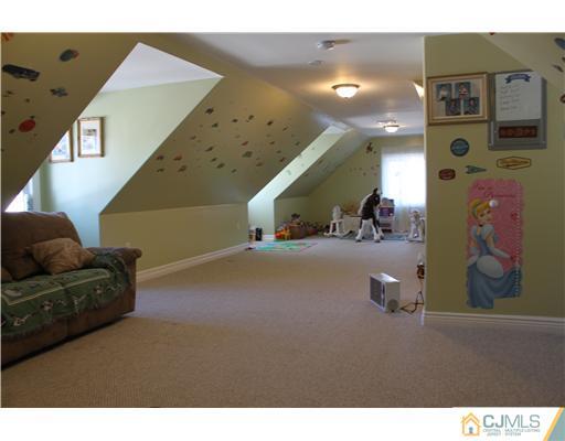 417 Plainfield Road Edison, NJ 08820 - Photo 14 of 14 a living room with furniture and a flat screen tv
