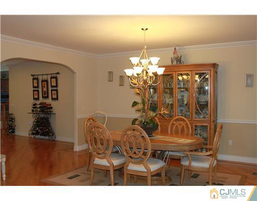 417 Plainfield Road Edison, NJ 08820 - Photo 3 of 14 a view of a dining room with furniture and chandelier