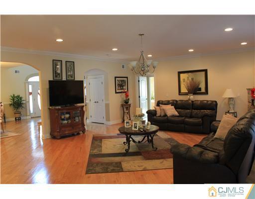 417 Plainfield Road Edison, NJ 08820 - Photo 5 of 14 a living room with furniture and a flat screen tv