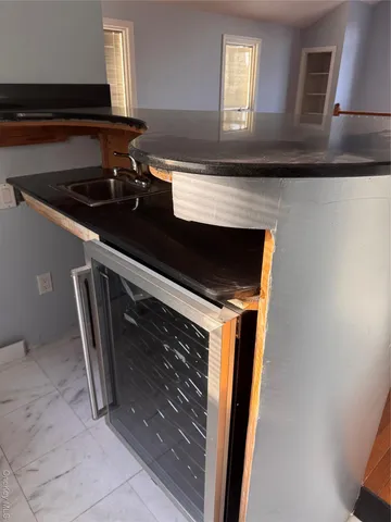 a kitchen with a sink and a microwave