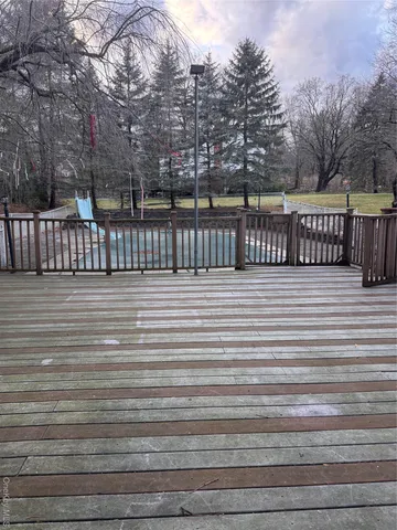 a view of a house with a tree