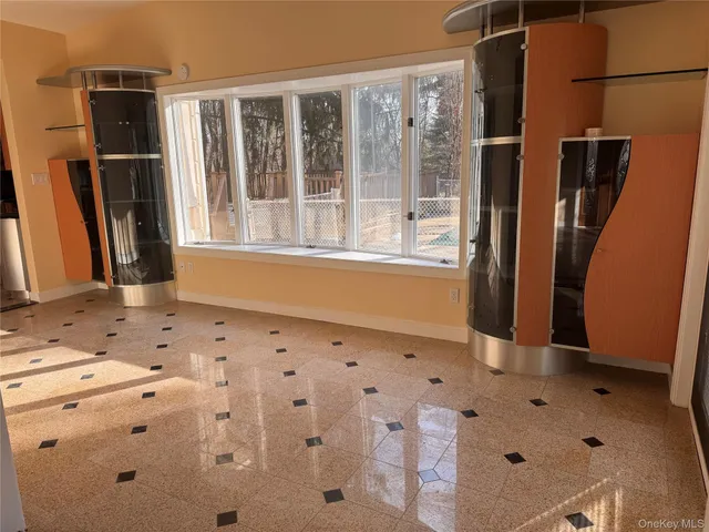 a view of wooden floor and a window