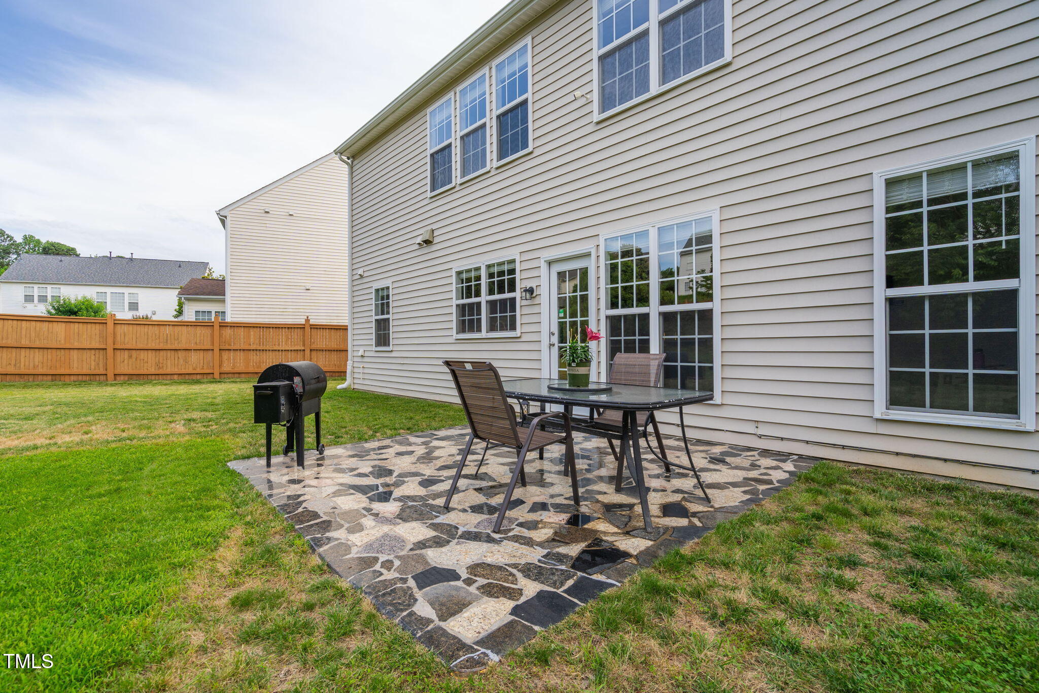 7612 Vista Del Rey Lane Raleigh, NC 27613 - Photo 56 of 73 Gorgeous Patio With Granite Rock Glass Tiles