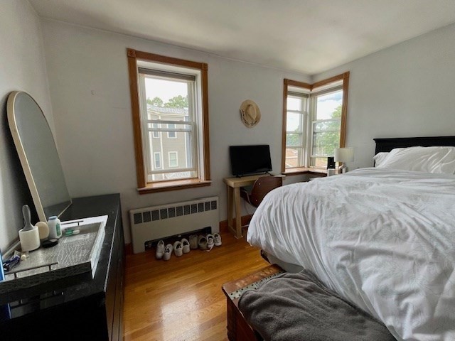 125 Farragut Road, Unit 46 Boston, MA 02127 - Photo 13 of 15 a bedroom with a bed and a window