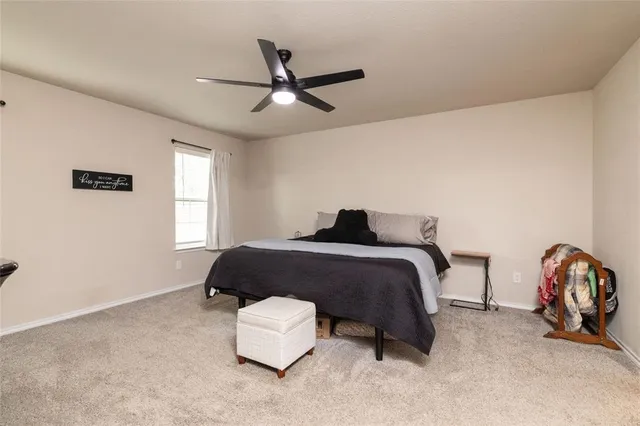 a bedroom with a bed furniture and a window