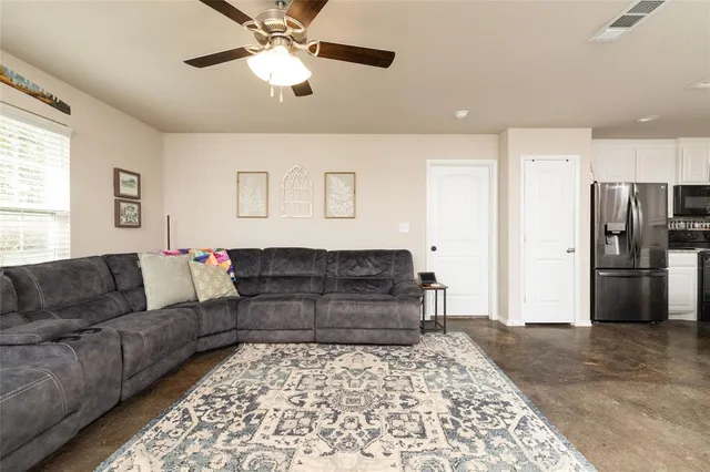 a living room with furniture and a rug